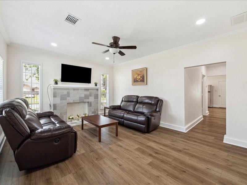 1801 Hussion Street Houston, TX 77003 - Photo 6 of 20 a living room with furniture a fireplace and a flat screen tv