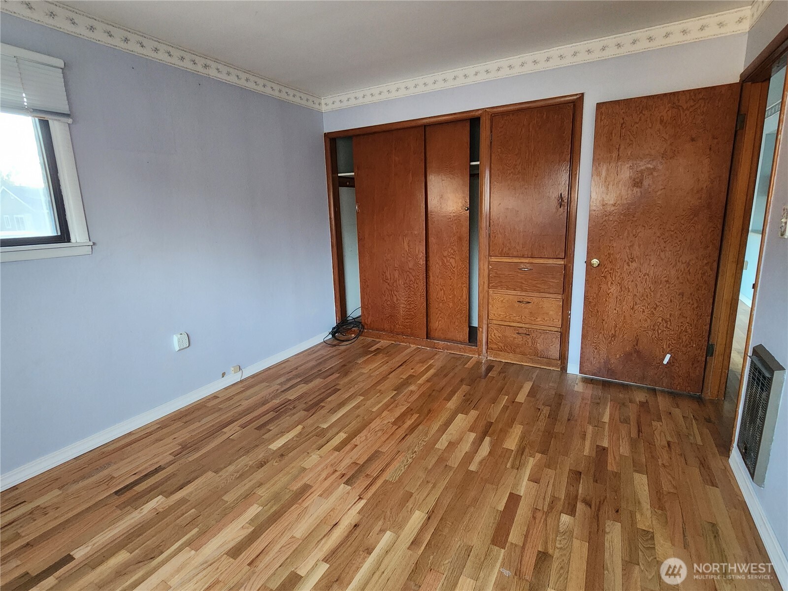 111 K Street Southwest Quincy, WA 98848 - Photo 9 of 19 a view of an empty room with wooden floor and a window