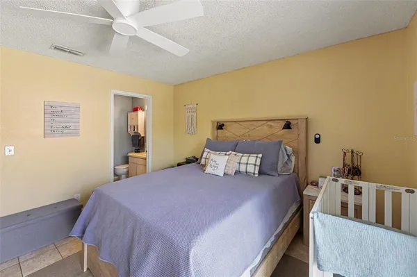 a bedroom with a bed and a table in it