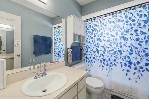 a view of a backyard with a patio and outdoor seating