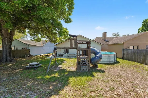 a front view of a house with a yard and porch