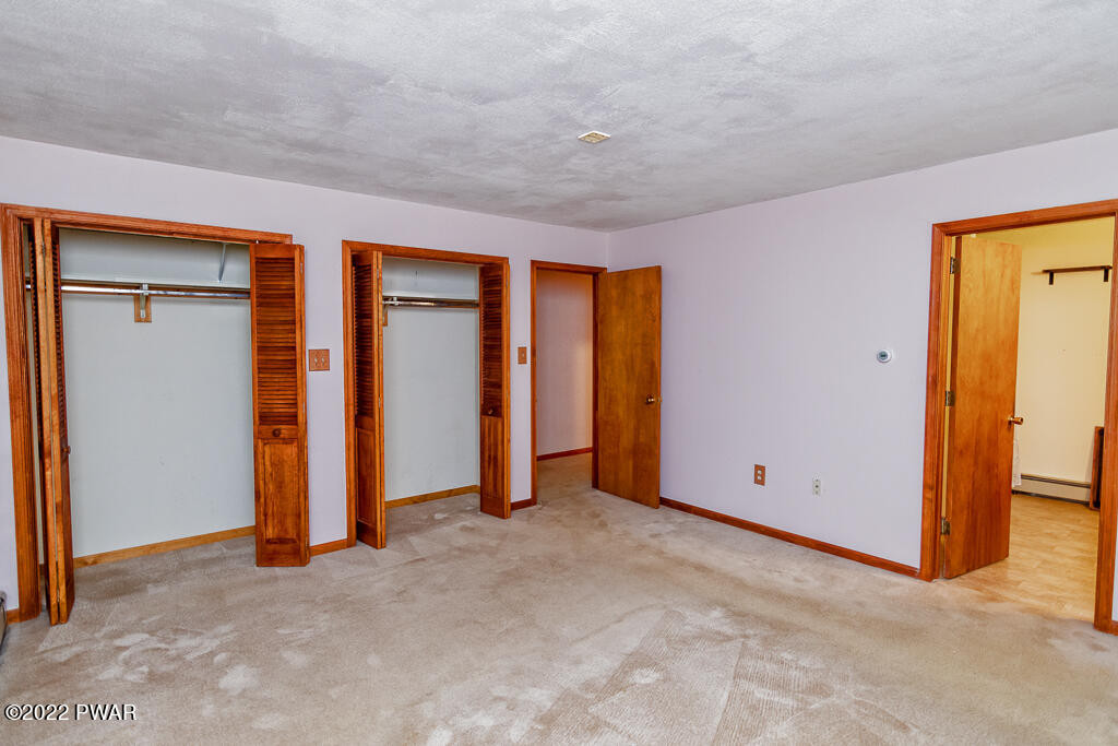 166 Devils Hole Road Cresco, PA 18326 - Photo 16 of 46 an empty room with closet