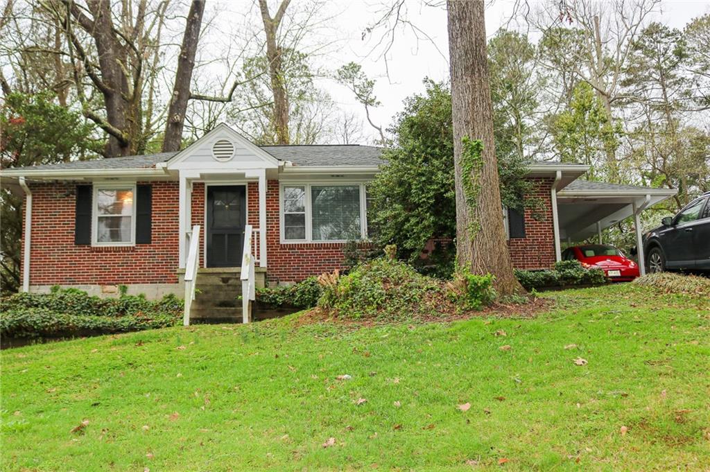 1212 Willivee Drive Decatur, GA 30033 - Photo 1 of 1 a front view of a house with garden
