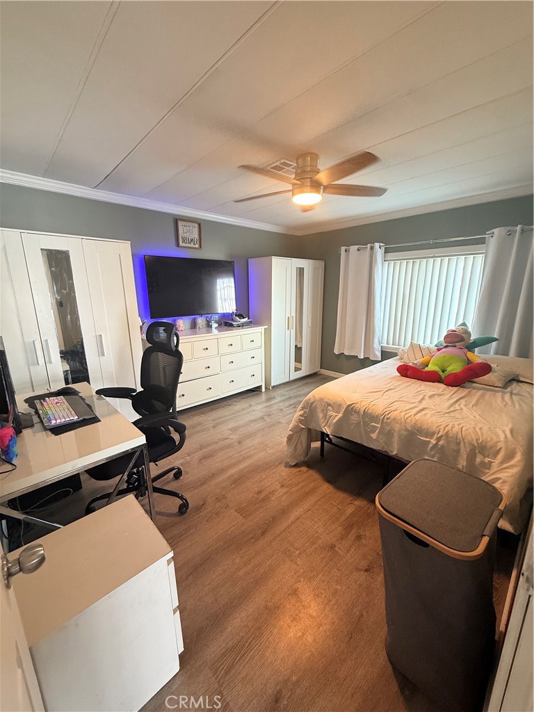 626 Dearborn, Unit 7 Redlands, CA 92374 - Photo 4 of 12 a bedroom with bed and a window