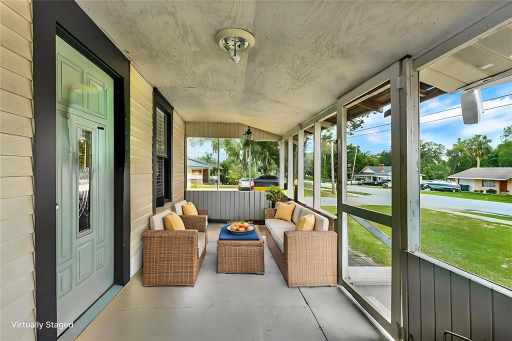 520 Dora Avenue Tavares, FL 32778 - Photo 14 of 17 a view of a porch with furniture and floor to ceiling window