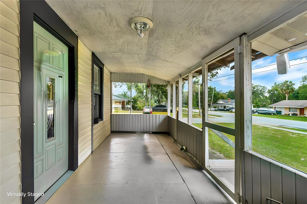 520 Dora Avenue Tavares, FL 32778 - Photo 15 of 17 a view of a large room with a floor to ceiling window
