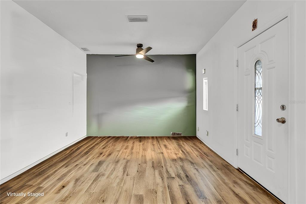 520 Dora Avenue Tavares, FL 32778 - Photo 4 of 17 wooden floor in a empty room