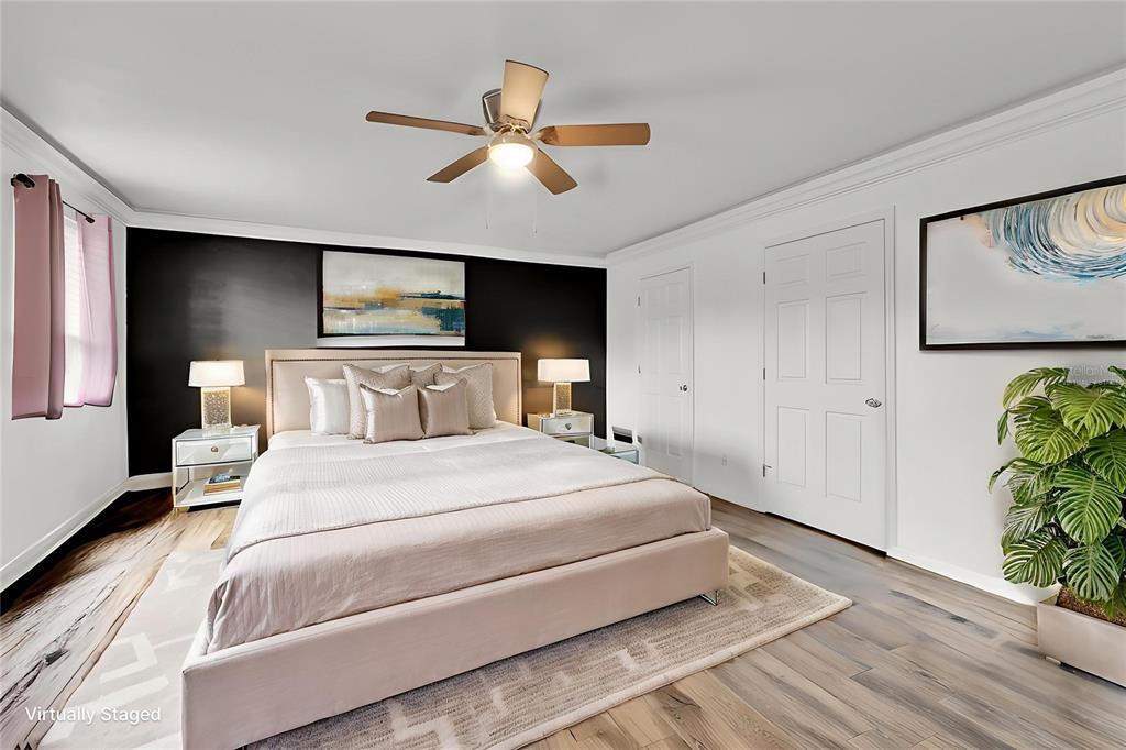 520 Dora Avenue Tavares, FL 32778 - Photo 7 of 17 a bedroom with bed and window