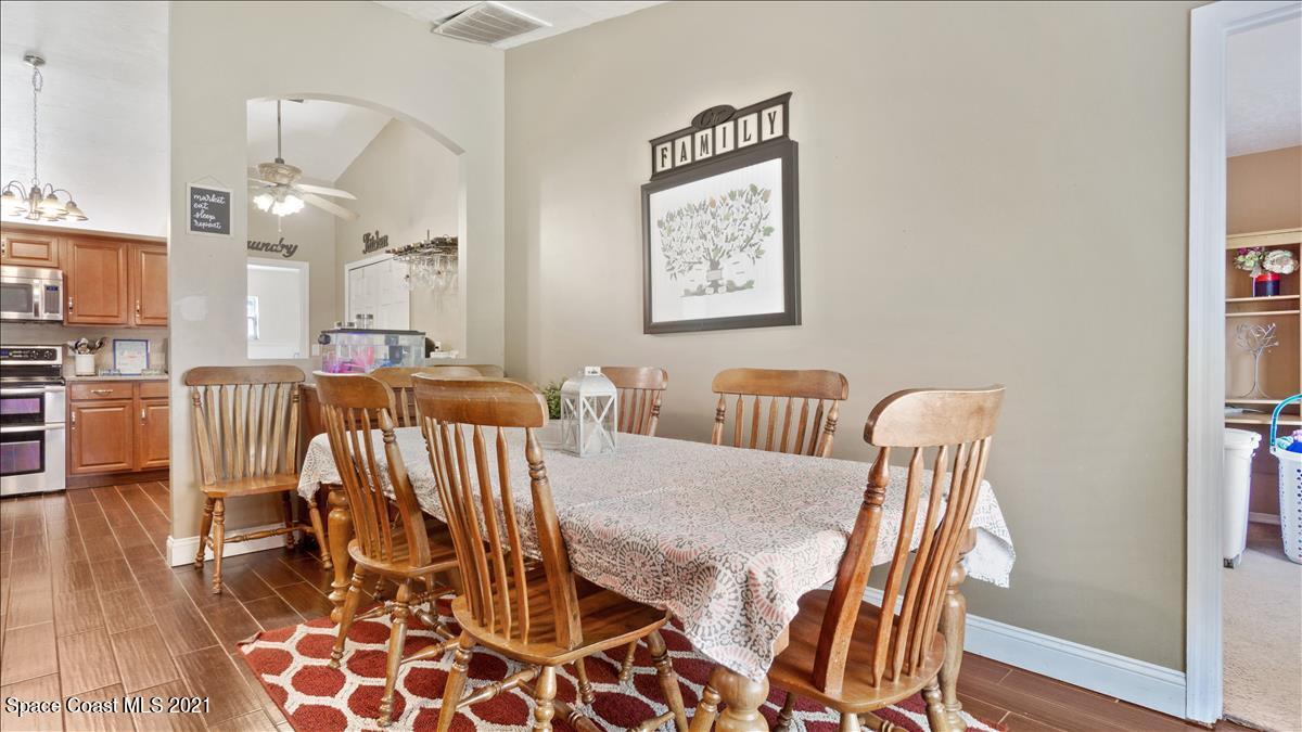 7220 Freeport Road Cocoa, FL 32927 - Photo 14 of 25 a view of a dining room with furniture