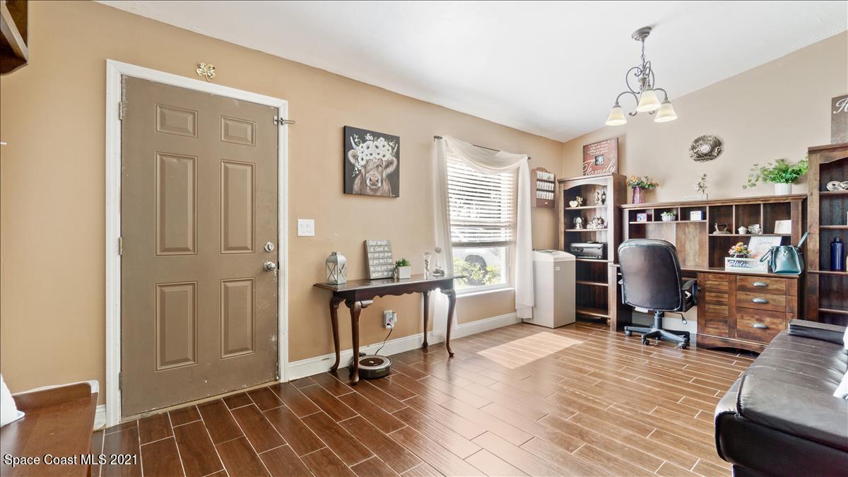 7220 Freeport Road Cocoa, FL 32927 - Photo 19 of 25 a view of a livingroom with workspace and a window