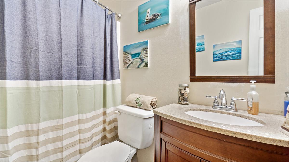 7220 Freeport Road Cocoa, FL 32927 - Photo 21 of 25 a bathroom with a granite countertop sink and a mirror