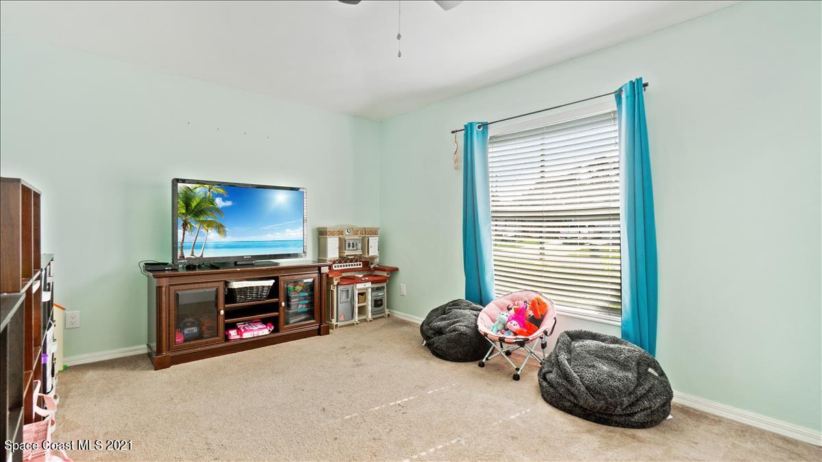 7220 Freeport Road Cocoa, FL 32927 - Photo 22 of 25 a view of a livingroom with furniture and toys