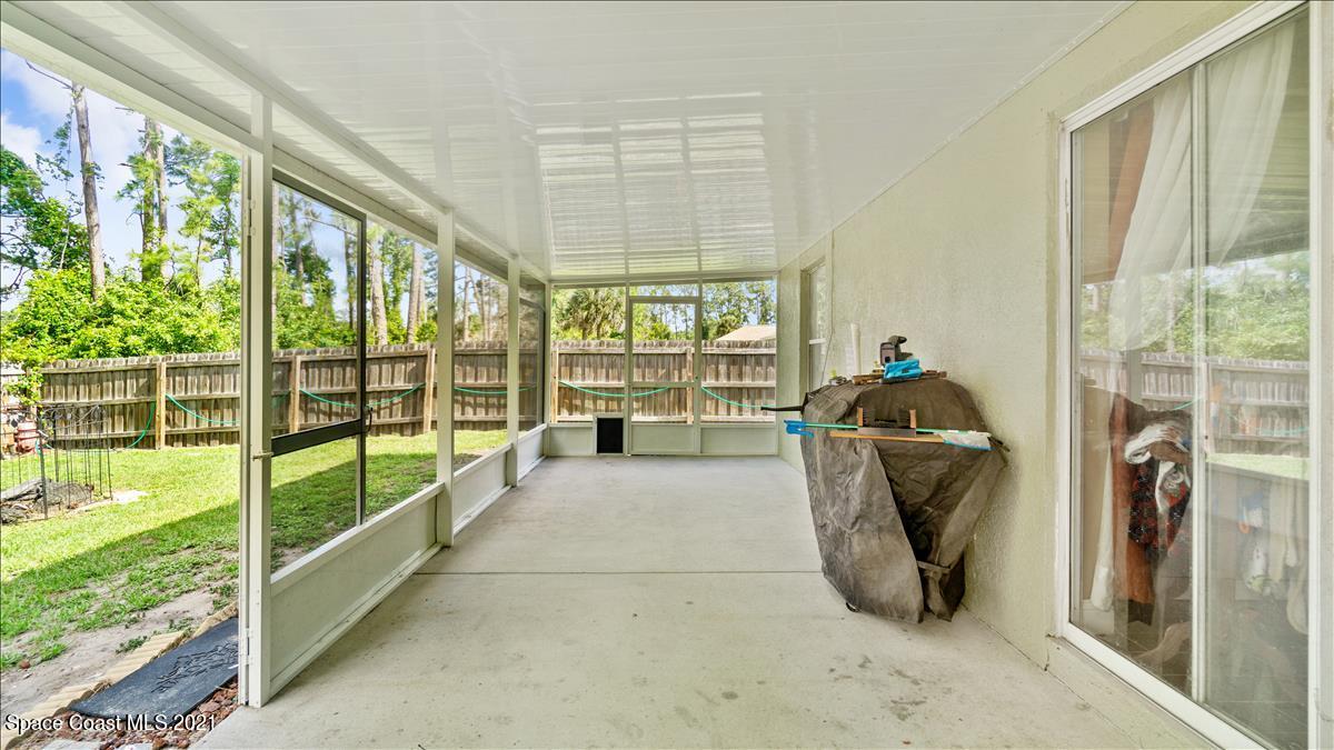 7220 Freeport Road Cocoa, FL 32927 - Photo 7 of 25 a view of a large room with balcony and furniture