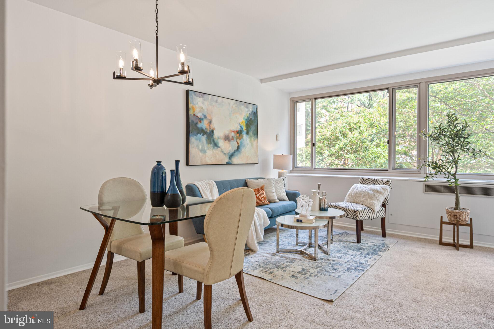 4101 Cathedral Avenue Northwest, Unit 616 Washington, DC 20016 - Photo 5 of 27 a view of a livingroom and a dining room with furniture window and outside view