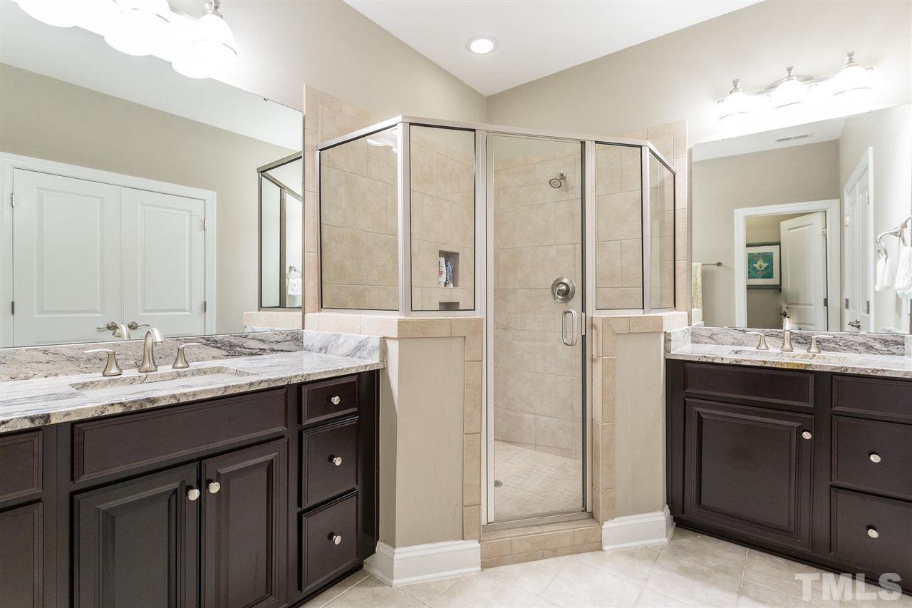 225 Penley Circle Raleigh, NC 27609 - Photo 11 of 18 a bathroom with a granite countertop sink mirror and double