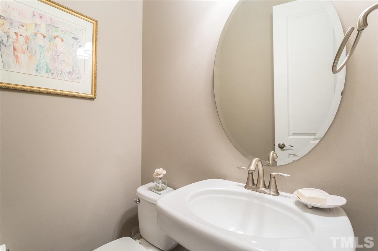 225 Penley Circle Raleigh, NC 27609 - Photo 15 of 18 a bathroom with a sink and a mirror