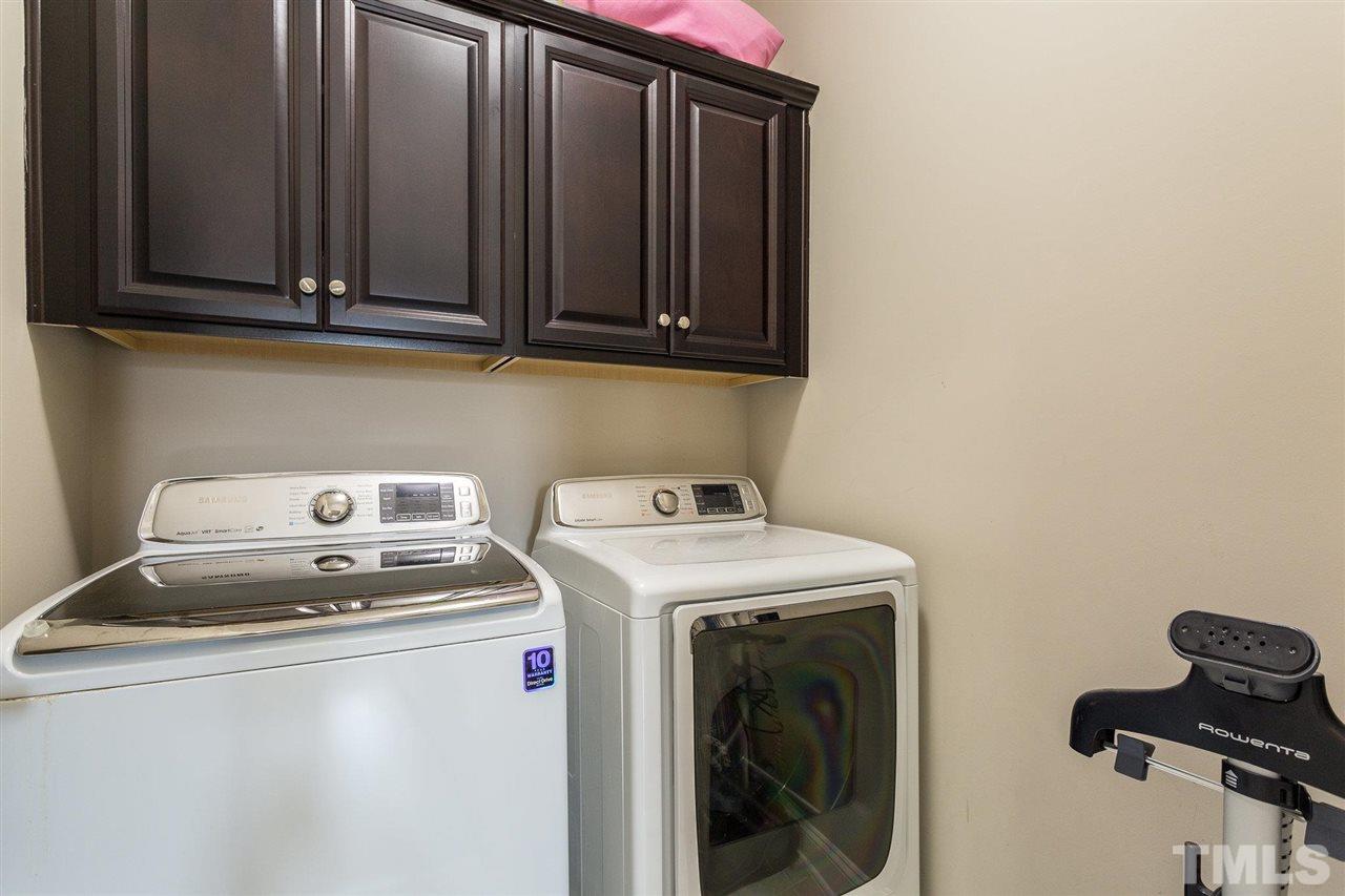 225 Penley Circle Raleigh, NC 27609 - Photo 16 of 18 a utility room with dryer and washer