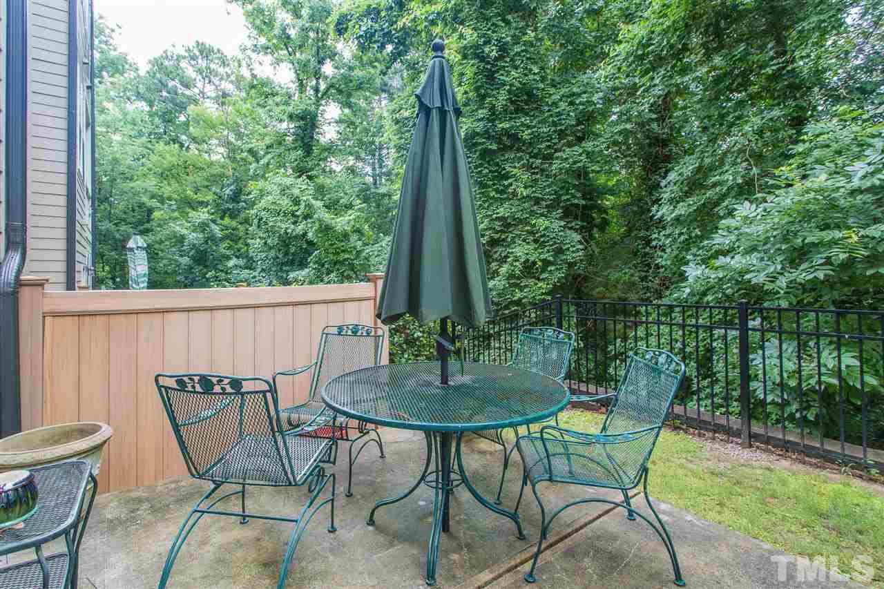 225 Penley Circle Raleigh, NC 27609 - Photo 17 of 18 a view of chair and table in the garden