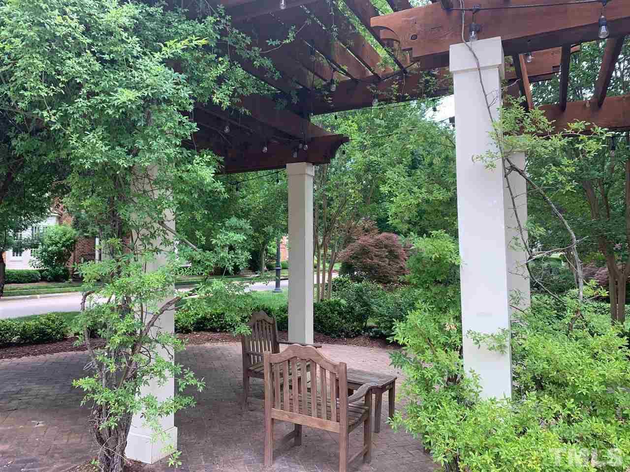 225 Penley Circle Raleigh, NC 27609 - Photo 4 of 18 a view of an chair and table in the garden