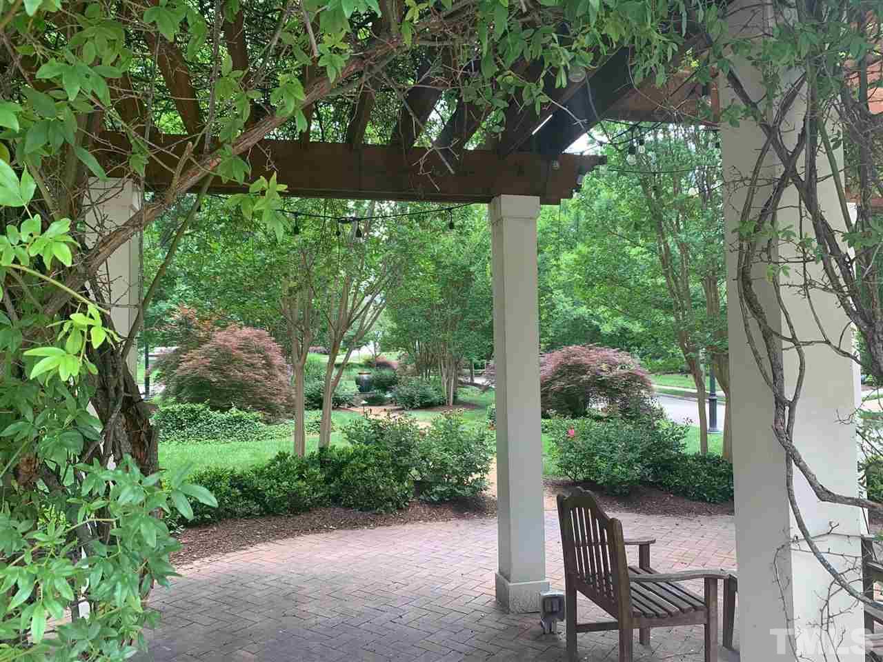 225 Penley Circle Raleigh, NC 27609 - Photo 6 of 18 a view of a chair and table in the garden