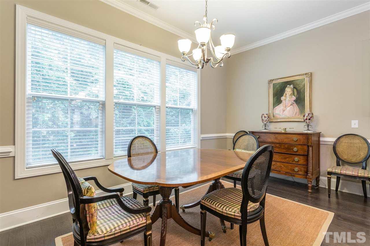 225 Penley Circle Raleigh, NC 27609 - Photo 9 of 18 a view of a dining room with furniture window and wooden floor
