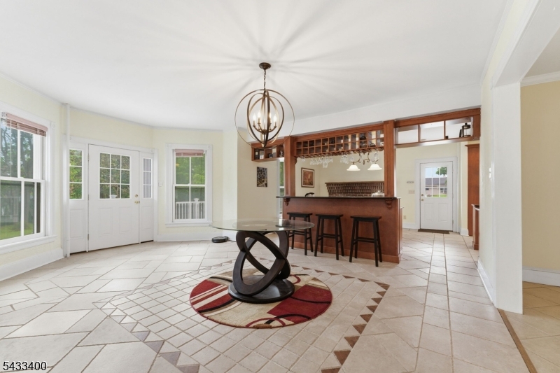 61 New Street Hampton, NJ 08827 - Photo 24 of 45 a living room with furniture a flat screen tv and kitchen view