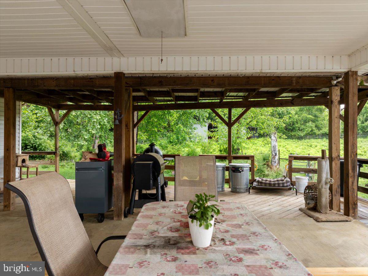 11419 Oak Grove Road Bristol, VA 24202 - Photo 25 of 36 a view of a patio with a table and chairs