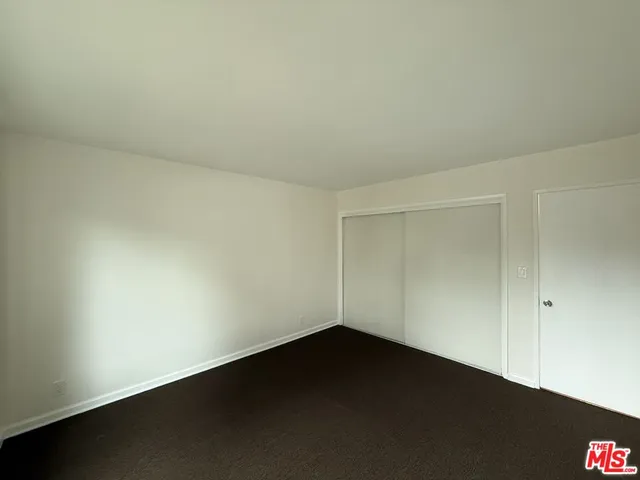 an empty room with a bench