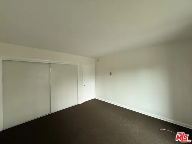 an empty room with a bench