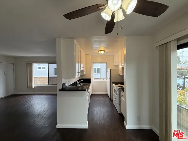 a view of a kitchen cabinets and wooden floor