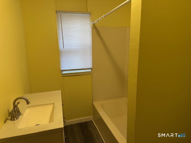 126 Smith Street, Unit 3 Derby, CT 06418 - Photo 9 of 10 a bathroom with a sink and a mirror