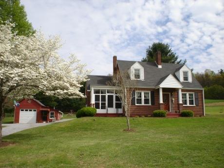 10664 Bent Mountain Road Bent Mountain, VA 24059 - Photo 1 of 1 front view of a house with a yard
