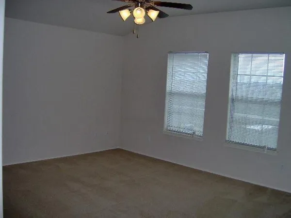 a bathroom with a light fixture and a toilet