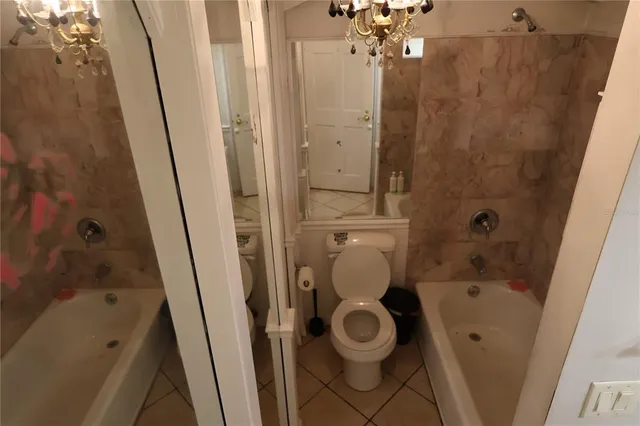 a bathroom with a bathtub and sink