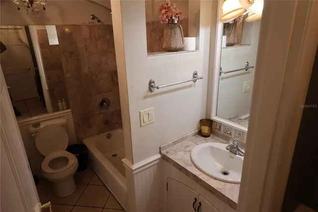 a kitchen with cabinets and stainless steel appliances