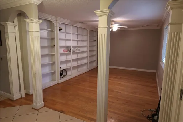 a view of walk in closet with empty racks