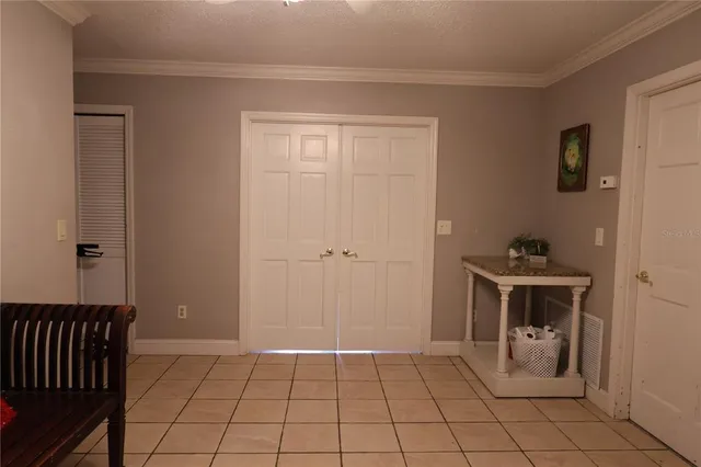 a view of a living room and bathroom with furniture