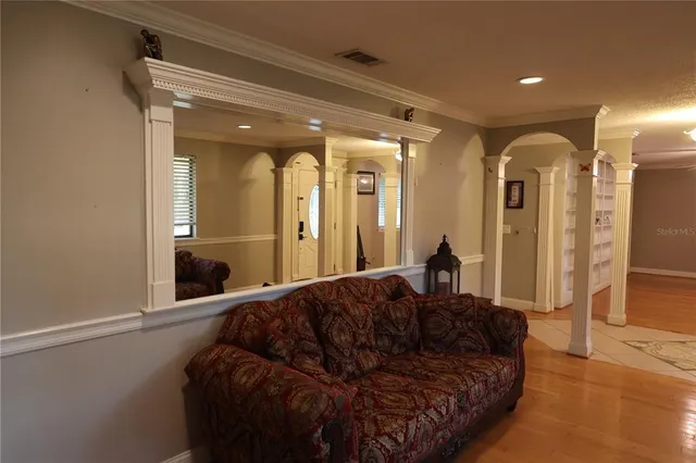a living room with a couch and a dresser