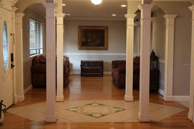 a view of a hallway with wooden walls