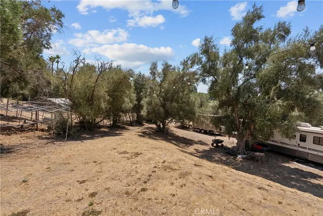 a view of swimming pool with sitting area and garden