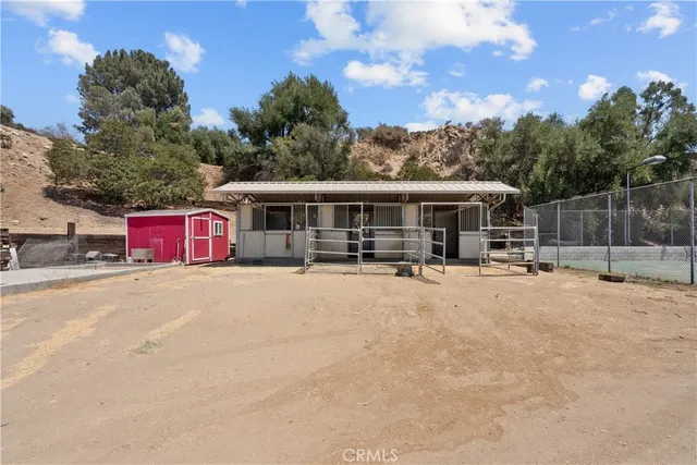 a view of a terrace with furniture and city view