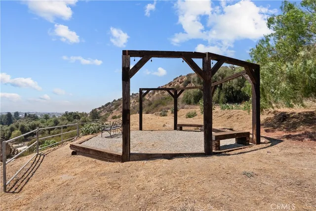 a view of a patio with couches and a fire pit