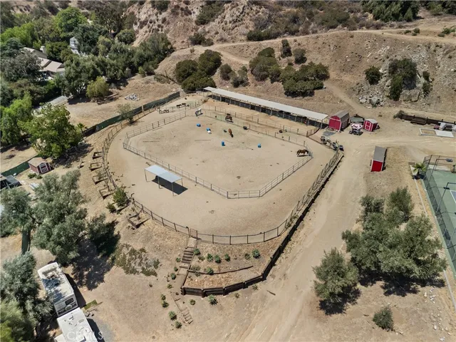 an aerial view of a residential houses with outdoor space
