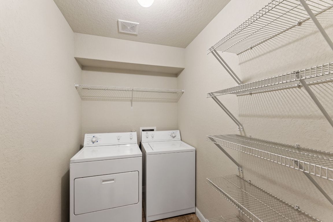 582 Briggs Drive New Braunfels, TX 78130 - Photo 15 of 32 a utility room with dryer and washer