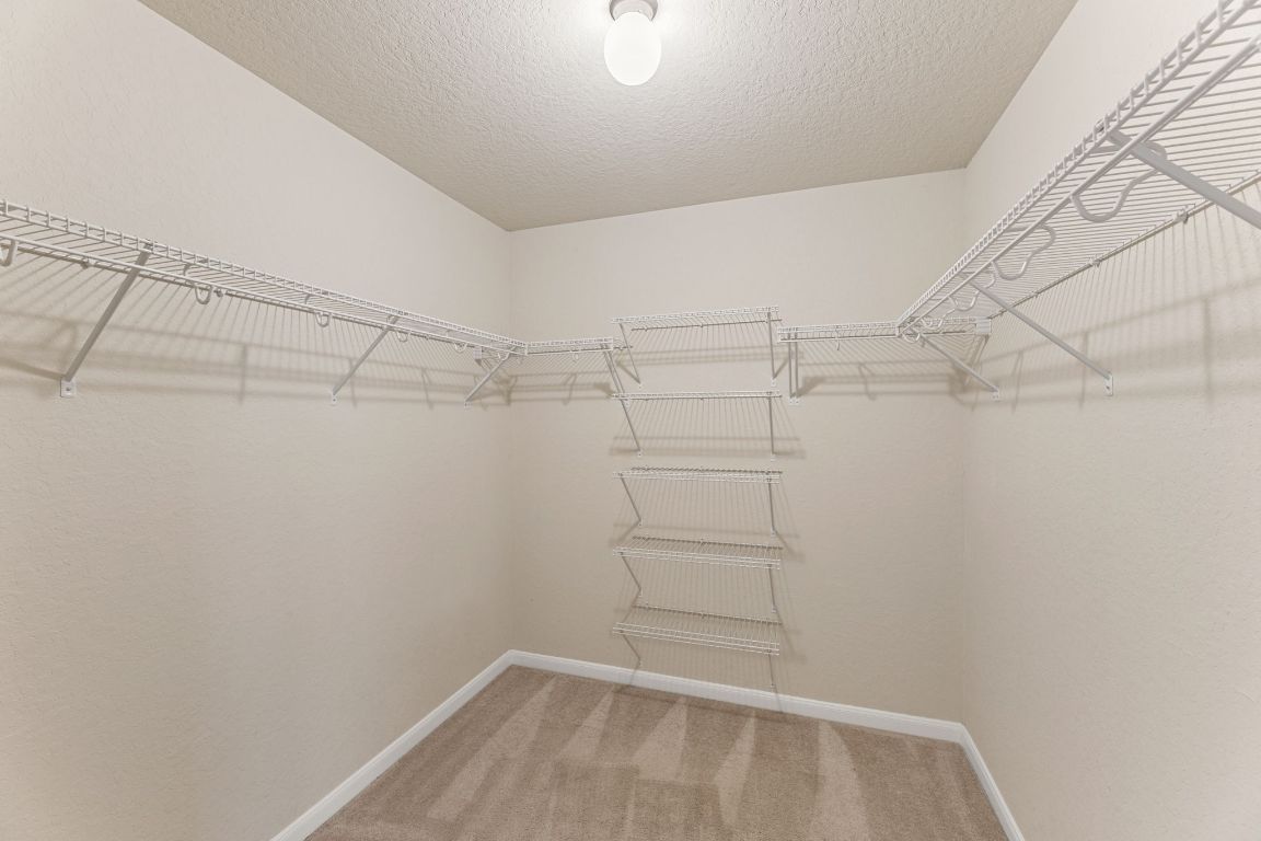 582 Briggs Drive New Braunfels, TX 78130 - Photo 20 of 32 a view of a room with racks on the wall