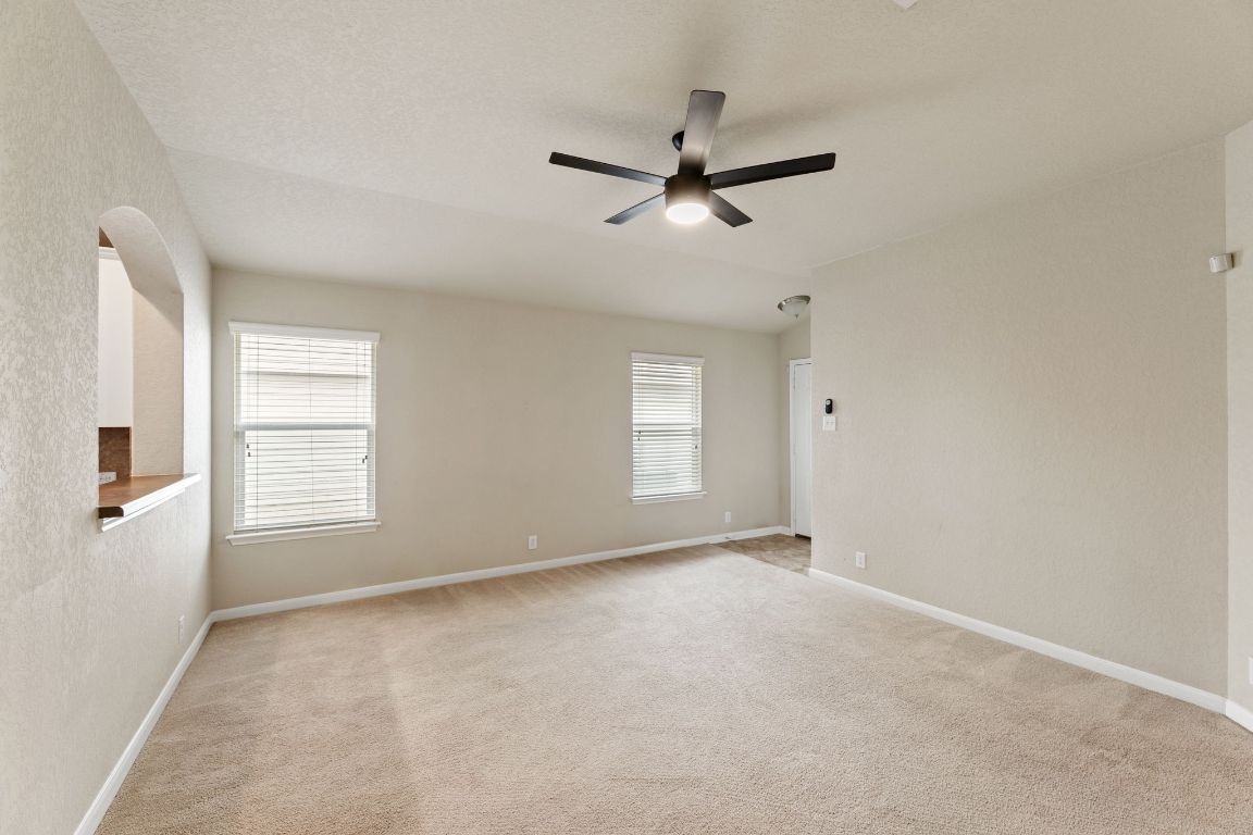 582 Briggs Drive New Braunfels, TX 78130 - Photo 7 of 32 a view of an empty room with a window