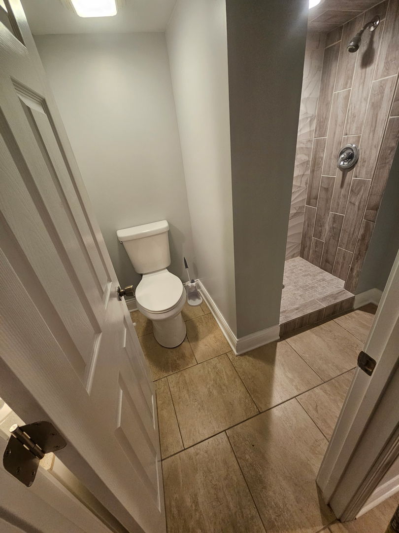 2436 Spruce Street River Grove, IL 60171 - Photo 16 of 19 a bathroom with a toilet and a shower