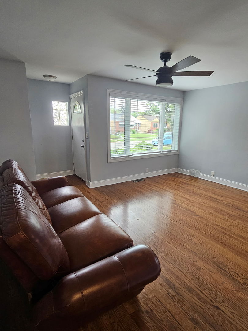 2436 Spruce Street River Grove, IL 60171 - Photo 2 of 19 a living room with furniture and a large window