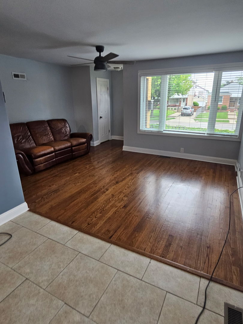 2436 Spruce Street River Grove, IL 60171 - Photo 3 of 19 en empty room with windows and ceiling fan