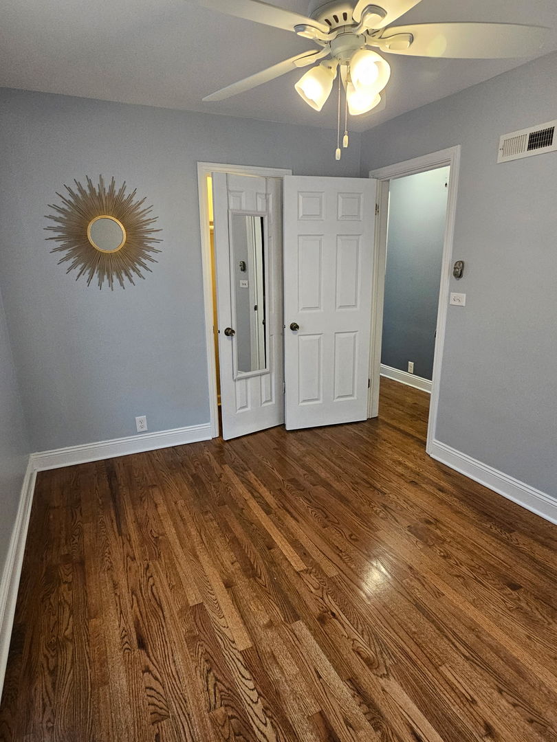 2436 Spruce Street River Grove, IL 60171 - Photo 9 of 19 a view of an empty room and wooden floor